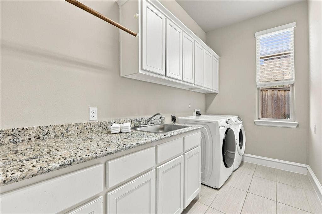 6200 Corsica Way, Plano, TX 75024 Oversized laundry room with granite counters, cabinets and sink