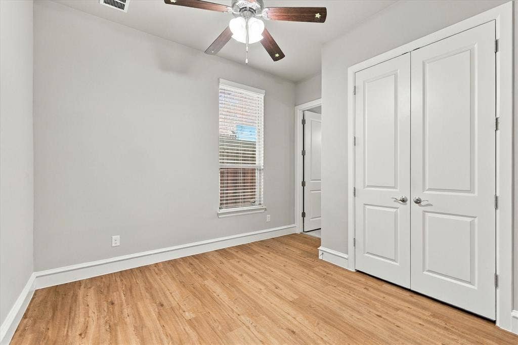 6200 Corsica Way, Plano, TX 75024 First floor secondary bedroom with wood floors and adjacent full bath