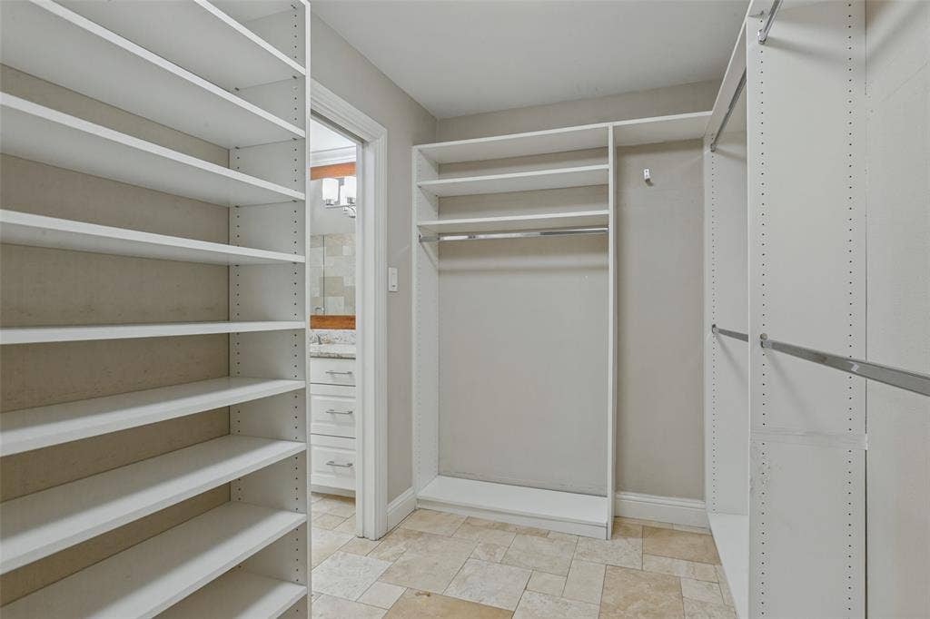 6507 Starling Circle, Dallas, TX 75209 Custom closet system in walk-in primary closet
