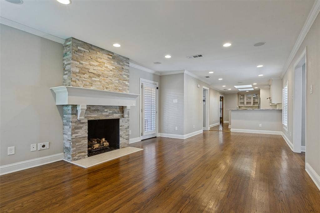 6507 Starling Circle, Dallas, TX 75209 Living area w gas-log fireplace and backyard access