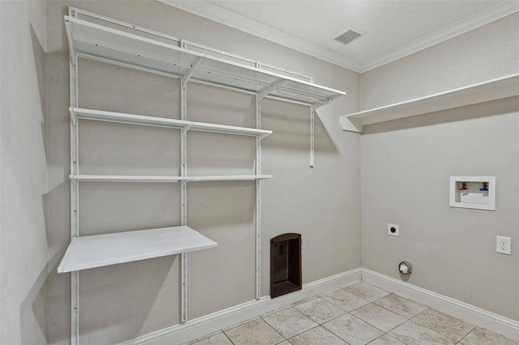 6507 Starling Circle, Dallas, TX 75209 Hallway utility room has ample storage and space for full size washer & dryer