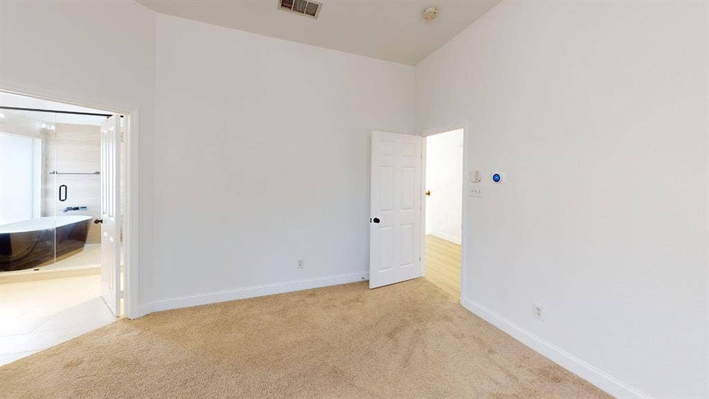 2254 Ash Grove Way, Dallas, TX 75228 Room with high ceiling, neutral carpet flooring, and six-panel interior doors