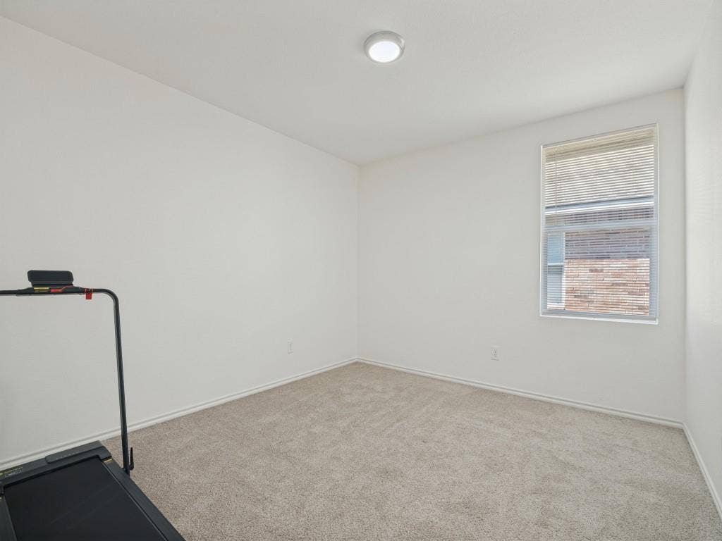1728 Harvest Crossing Drive, Wylie, TX 75098 Neutral-toned wall-to-wall carpeting, window with integrated blinds, and flush-mount ceiling lighting