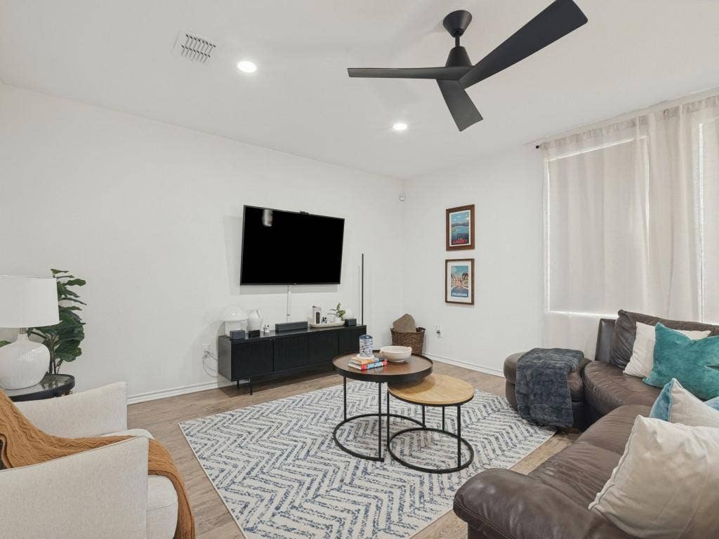 1728 Harvest Crossing Drive, Wylie, TX 75098 Modern matte black ceiling fan, recessed lighting, and wood-finish flooring