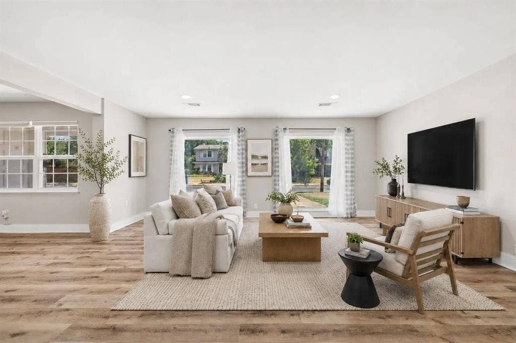 Neutral interior featuring wood-finish flooring, recessed lighting, and expansive windows