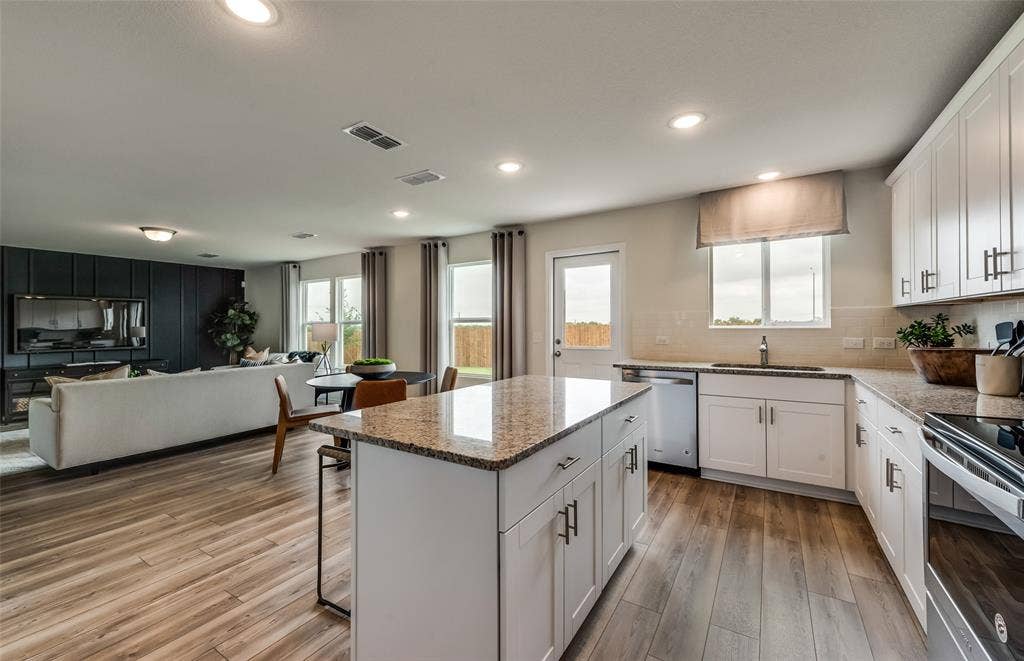 1056 Clear Dusk Lane, Forney, TX 75126 *Model Representation - Large island gathering room and dining areas overlooking