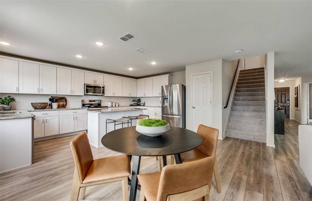 1056 Clear Dusk Lane, Forney, TX 75126 *Model Representation - Dining area off kitchen with large windows