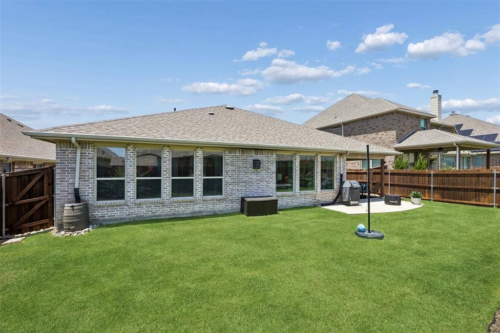 1321 Meridian Drive, Forney, TX 75126 Large backyard with a wooden privacy fence.