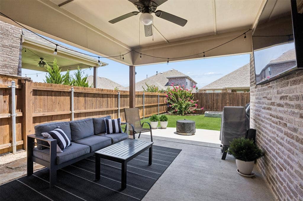 1321 Meridian Drive, Forney, TX 75126 Covered patio featuring a ceiling fan is the perfect spot for a summer morning