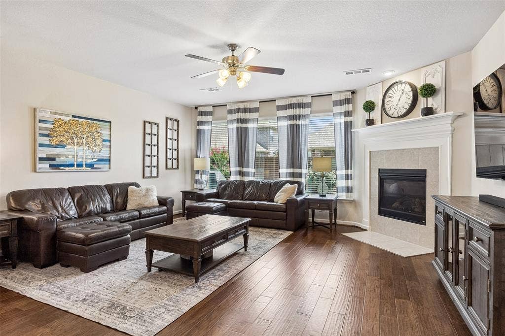 1321 Meridian Drive, Forney, TX 75126 The living area features multiple windows with blinds