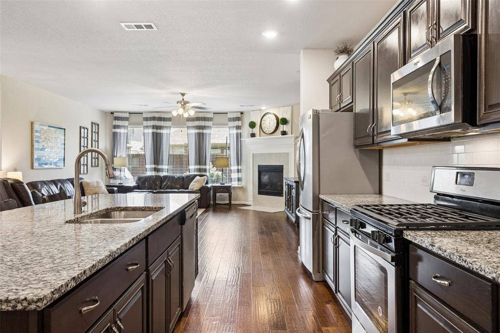 1321 Meridian Drive, Forney, TX 75126 Kitchen with stainless steel appliances including a gas range.