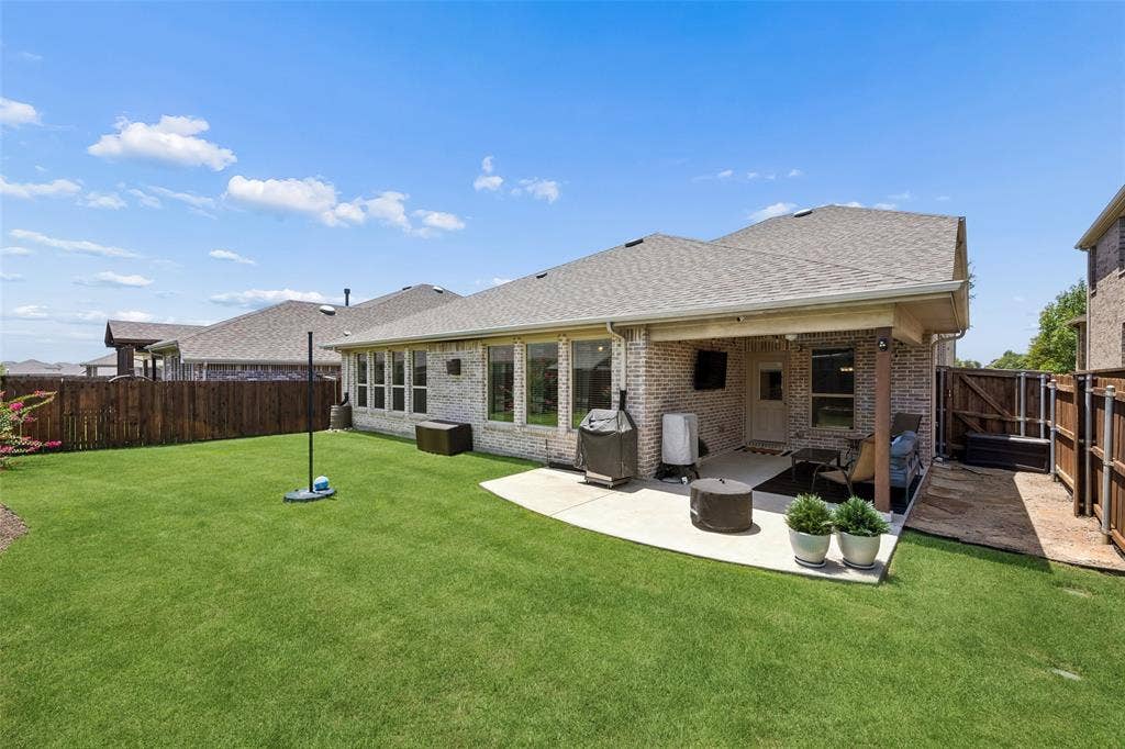 1321 Meridian Drive, Forney, TX 75126 View of the back of the house and the extended patio