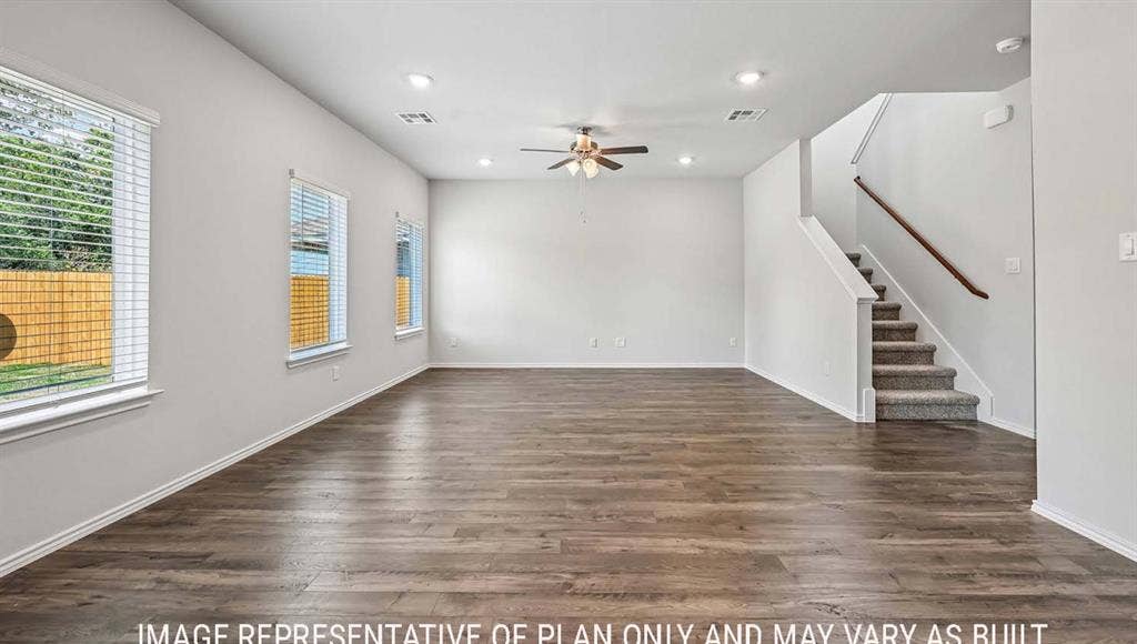 11709 Ceres Street, Lorena, TX 76655 Interior space featuring wood-finish flooring, recessed lighting, a ceiling fan, windows with horizontal blinds, and a staircase with a wooden handrail