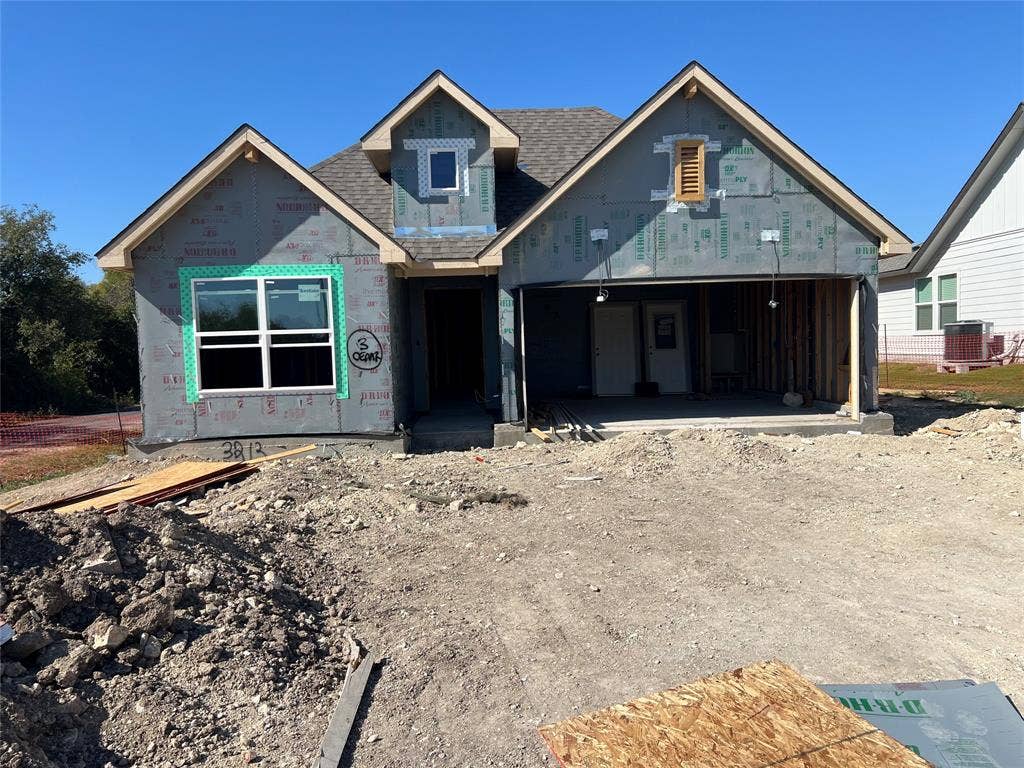 3213 Cyprian Road, Lorena, TX 76655 Single-story architectural design featuring a multi-gabled roofline, a front-facing attached two-car garage, and a central covered entryway