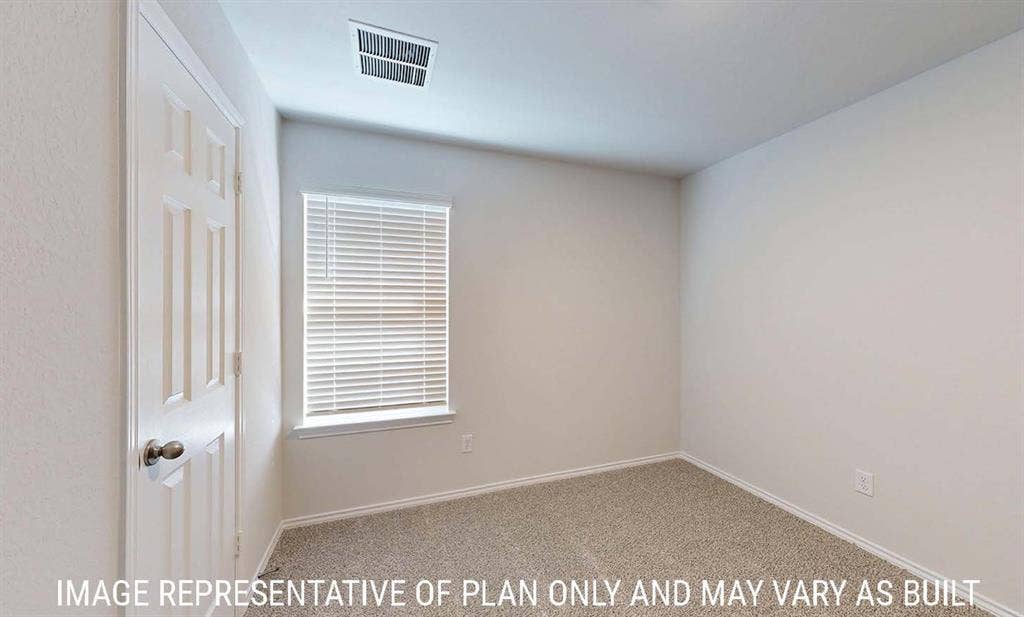 3213 Cyprian Road, Lorena, TX 76655 Neutral-toned carpeted flooring, white six-panel interior door with a round satin-finish knob, and window with white horizontal blinds