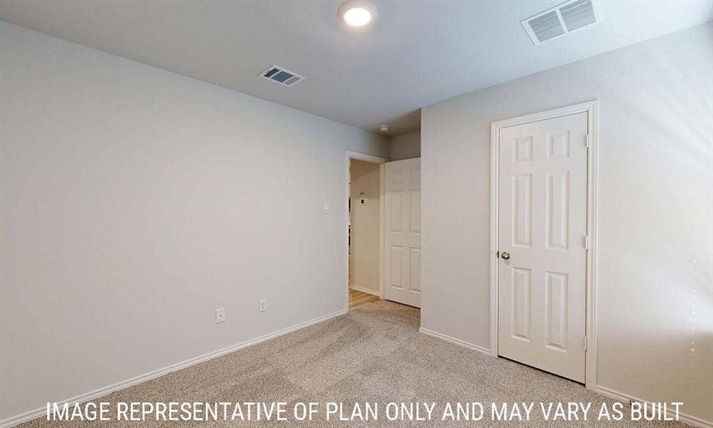 3213 Cyprian Road, Lorena, TX 76655 Neutral-toned interior featuring wall-to-wall carpeting, crisp white walls, and a six-panel interior door