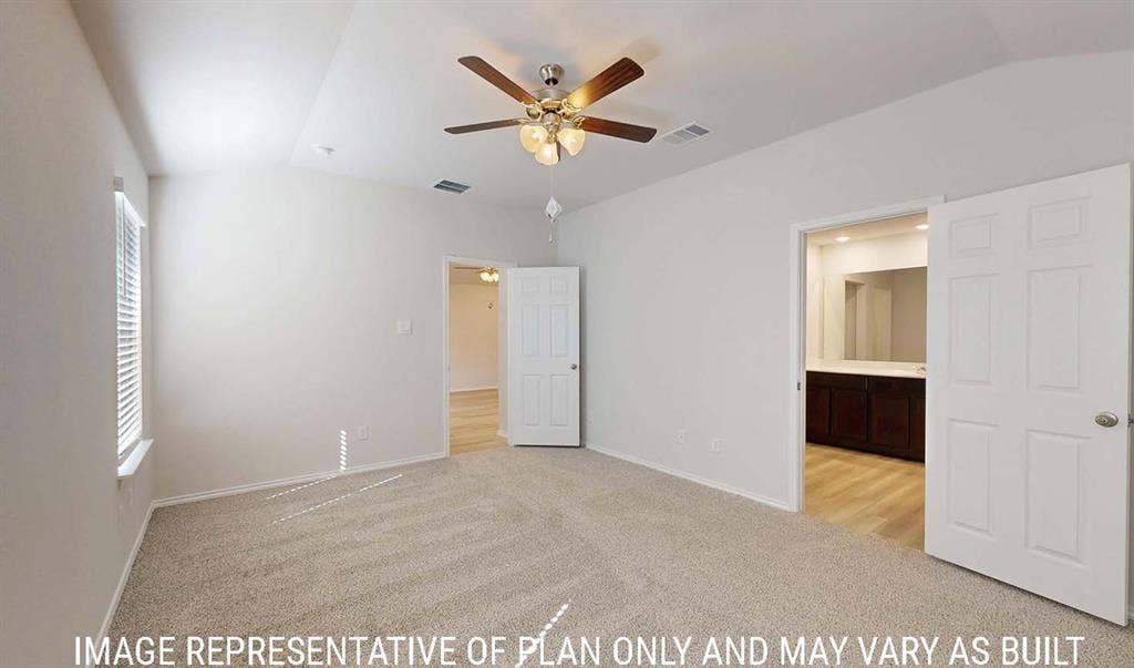 3213 Cyprian Road, Lorena, TX 76655 Vaulted ceiling with a central multi-blade ceiling fan, neutral wall-to-wall carpeting, and six-panel interior doors