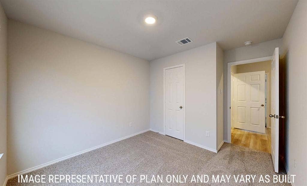 3213 Cyprian Road, Lorena, TX 76655 Neutral-toned interior featuring wall-to-wall carpeting, six-panel interior doors, and recessed lighting