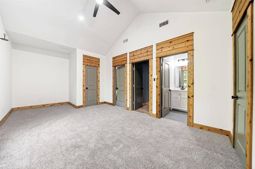 116 Carolynn Road, Mabank, TX 75156 Vaulted ceilings, neutral carpeting, natural wood-finish trim, paneled interior doors, and built-in ceiling fan