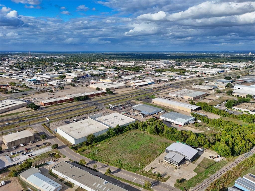 TBD Schroeder Drive, Waco, TX 76710 Aerial perspective of a commercial lot with paved access, concrete parking area, and multi-use warehouse facility