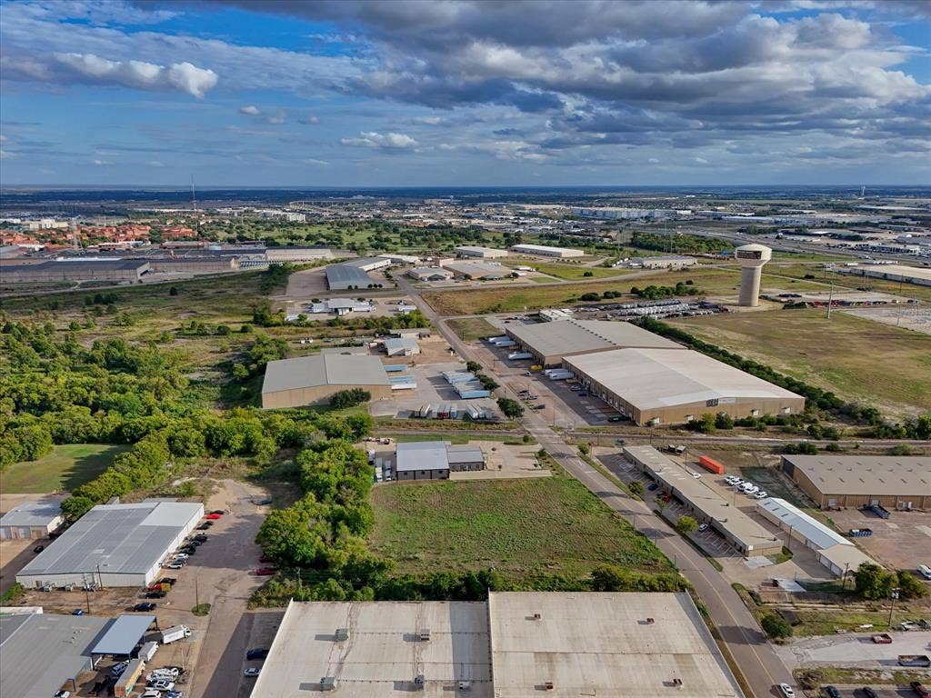 TBD Schroeder Drive, Waco, TX 76710 Aerial perspective of industrial site featuring extensive acreage, multiple metal-clad structures, dedicated paved parking areas, and established regional road access