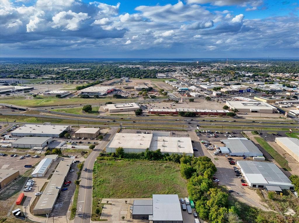 TBD Schroeder Drive, Waco, TX 76710 Aerial perspective of a corner lot featuring paved road access, frontage, and established regional infrastructure