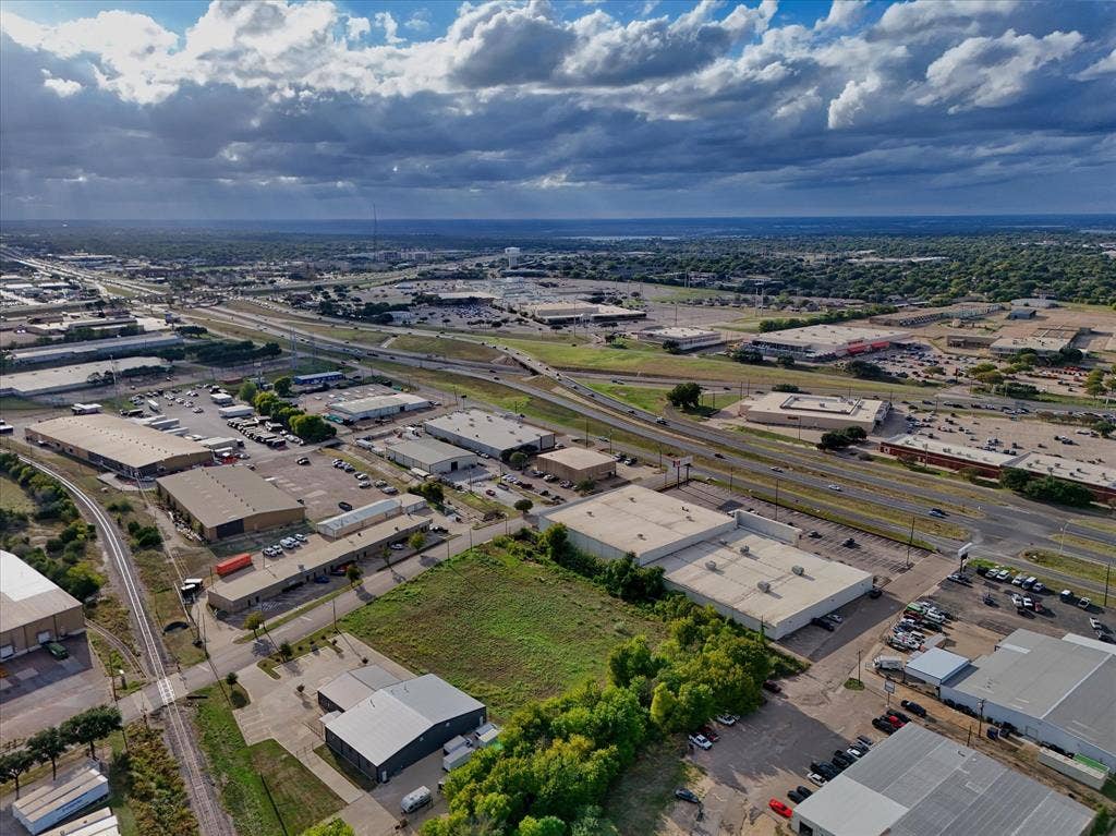 TBD Schroeder Drive, Waco, TX 76710 Aerial perspective showcasing a parcel of land in an industrial district with multi-lane highway frontage and rail line access