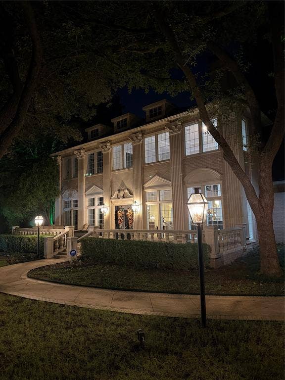 3011 Country Club Drive, McKinney, TX 75070 Multi-story exterior featuring classical pilasters, decorative molding, stone-finish balustrades, multi-pane windows, and a paved walkway