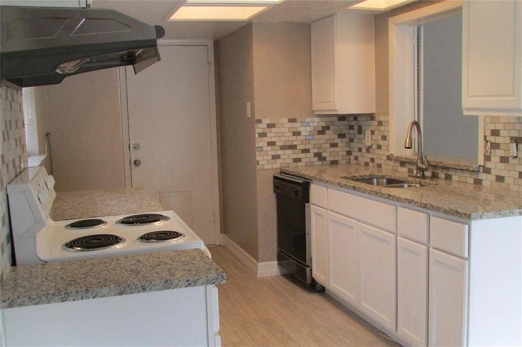 1217 Cloverdale Drive, Richardson, TX 75080 Kitchen featuring white cabinetry, stone-finish countertops, subway tile backsplash, recessed lighting, and a stainless steel high-arch faucet
