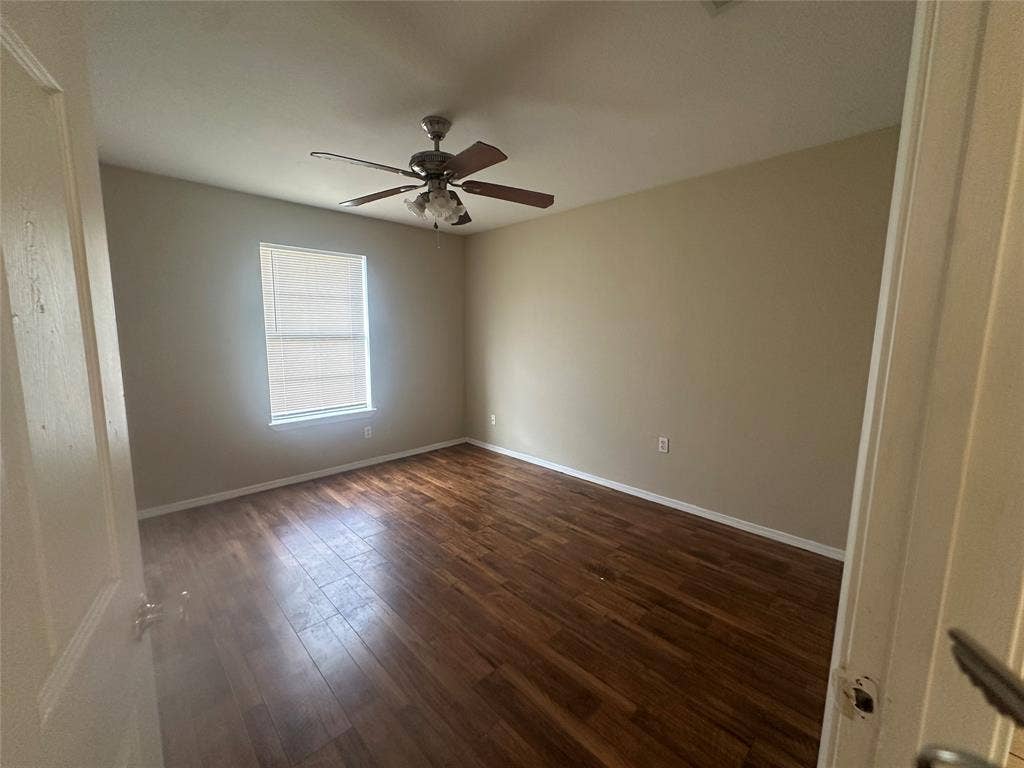 475 Perch Road, Rockwall, TX 75032 Room featuring wood-finish flooring, neutral wall paint, and a ceiling fan with integrated lighting