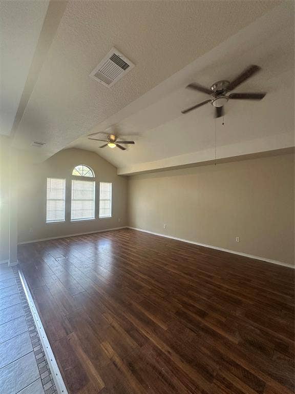 475 Perch Road, Rockwall, TX 75032 Vaulted ceiling featuring dual ceiling fans, wood-finish flooring, and arched window detailing