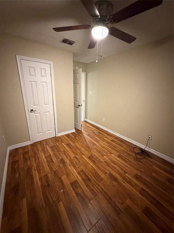 475 Perch Road, Rockwall, TX 75032 Wood-finish flooring, neutral wall tones, multi-panel interior doors, and a ceiling fan with integrated lighting