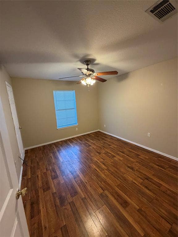 475 Perch Road, Rockwall, TX 75032 Interior room featuring wood-finish flooring, a single window, and a central ceiling fan with integrated light fixture