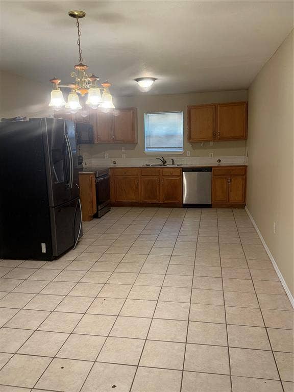 475 Perch Road, Rockwall, TX 75032 Kitchen featuring wood cabinetry, stainless steel dishwasher, ceramic tile flooring, and a multi-light hanging chandelier