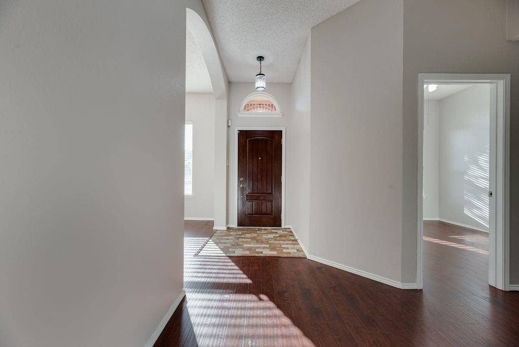 6310 Nueces Bay Drive, Rowlett, TX 75089 Engineered wood floors installed in 2020. Interior paint October 2026.