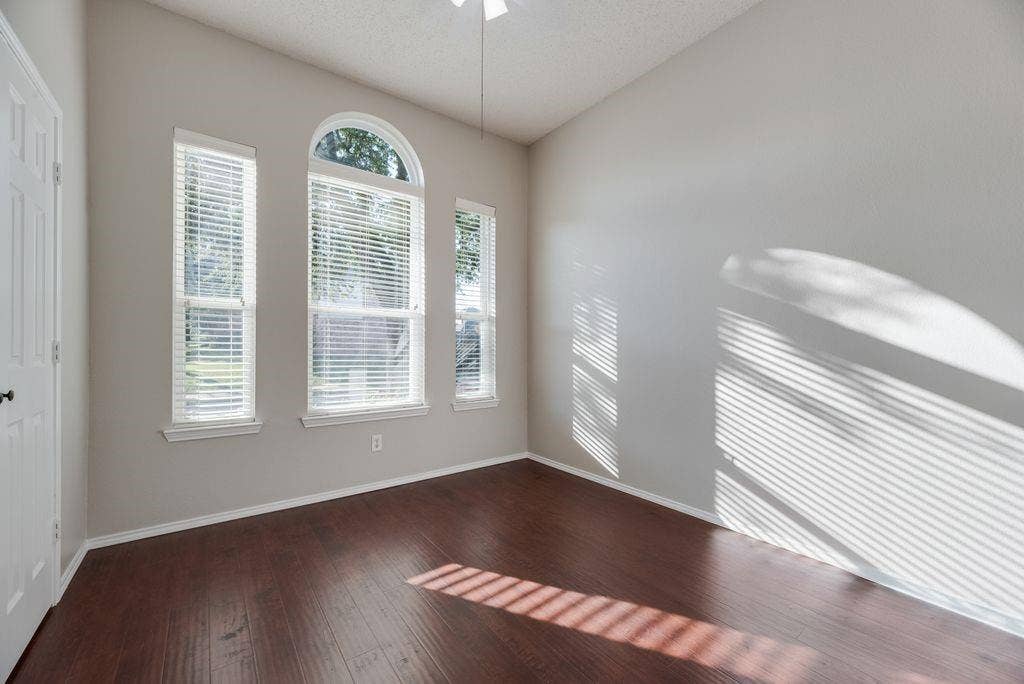 6310 Nueces Bay Drive, Rowlett, TX 75089 Bedroom with ceiling fan and closet.