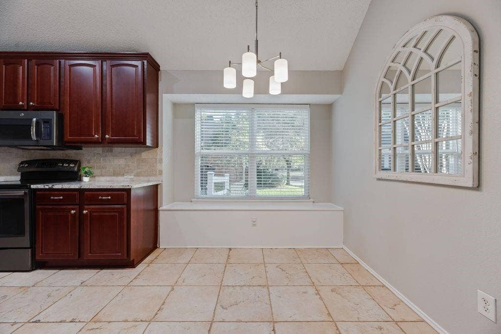 6310 Nueces Bay Drive, Rowlett, TX 75089 Dining area and large window to side yard.