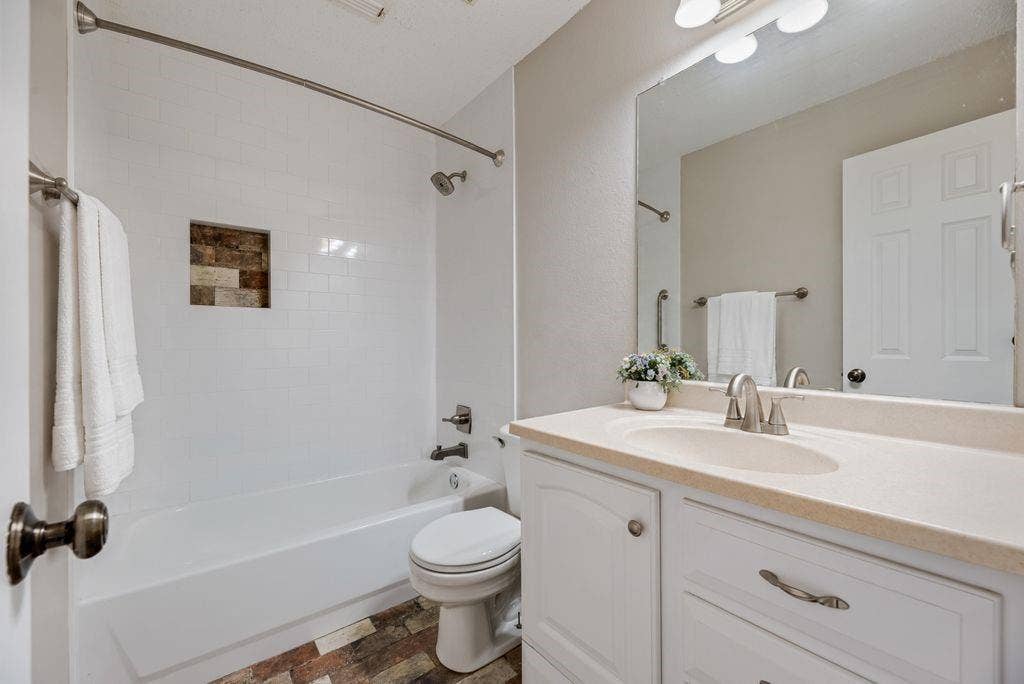 6310 Nueces Bay Drive, Rowlett, TX 75089 Updated secondary bathroom. New cabinets, tile and fixtures.