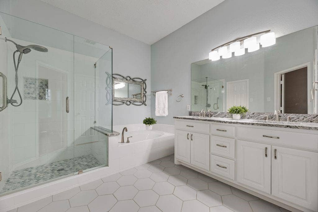 6310 Nueces Bay Drive, Rowlett, TX 75089 Beautifully updated primary bath with dual sinks, new cabinets and counter tops.