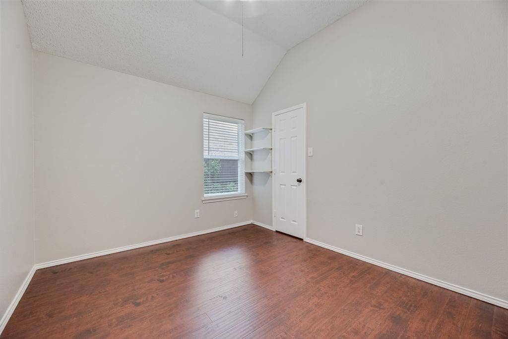 6310 Nueces Bay Drive, Rowlett, TX 75089 bedroom with ceiling fan and closet