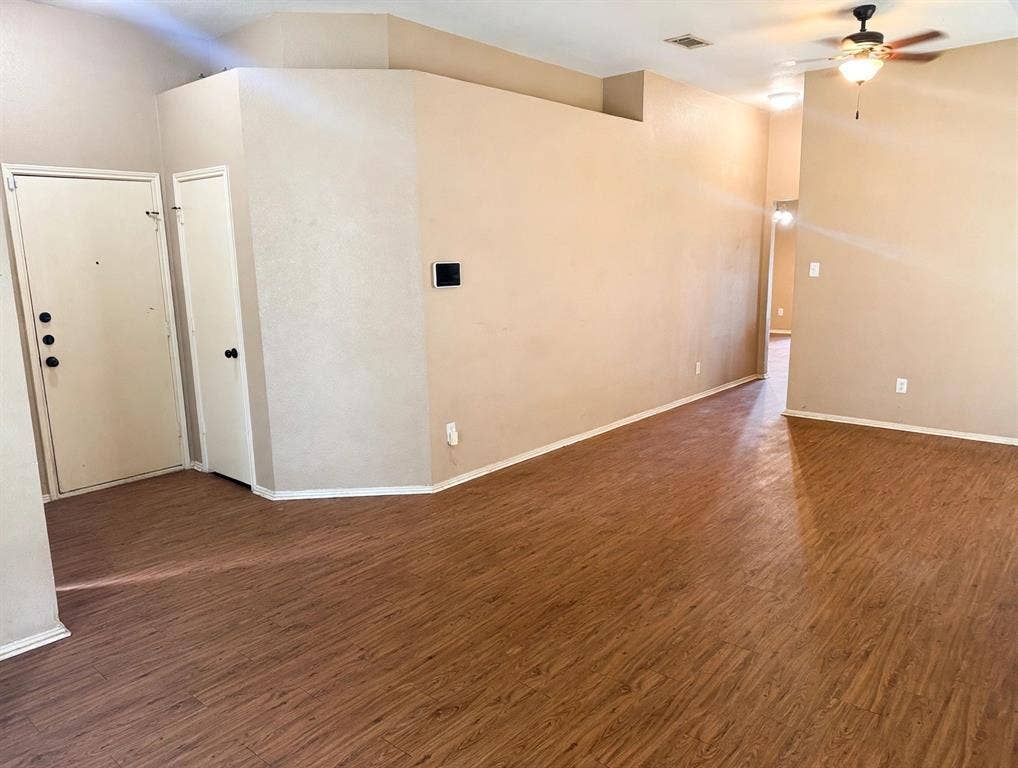 2053 Wild Creek Court, Dallas, TX 75253 Interior space featuring wood-finish flooring, vaulted ceilings, and a ceiling fan with integrated lighting