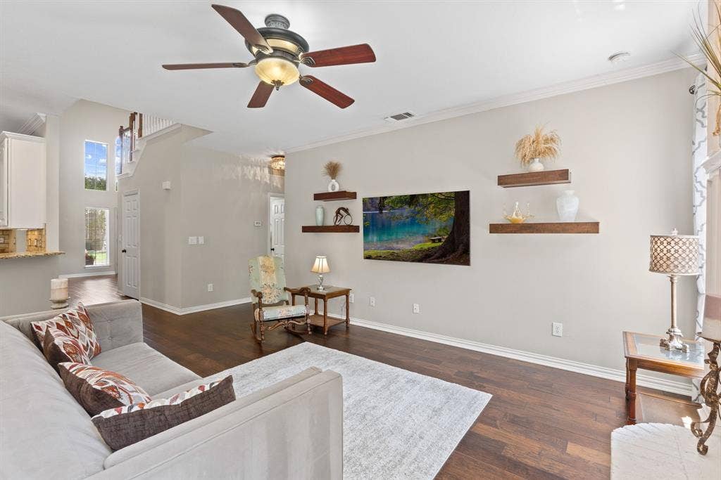 1110 Wedge Hill Road, McKinney, TX 75072 Wood-finish flooring, ceiling fan with integrated lighting, and wall-mounted wood shelving