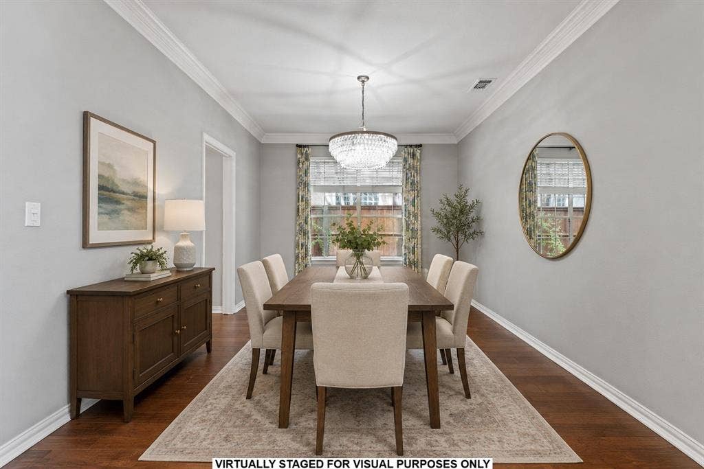 1110 Wedge Hill Road, McKinney, TX 75072 Dining area featuring wood-finish flooring, crown molding, and a crystal-accented chandelier