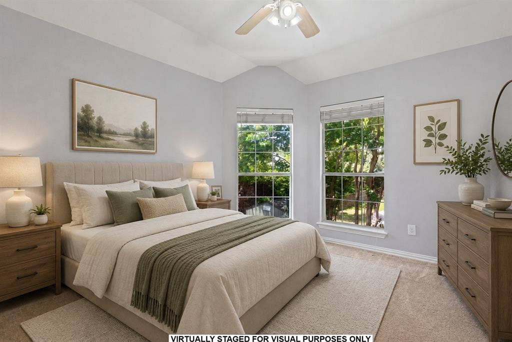 1110 Wedge Hill Road, McKinney, TX 75072 Vaulted ceiling featuring a central multi-blade ceiling fan, neutral wall tones, and tall multi-pane windows