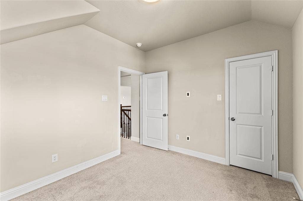 408 Abbott Lane, Waxahachie, TX 75165 Vaulted ceiling, neutral wall tones, wall-to-wall carpeting, and two-panel interior doors