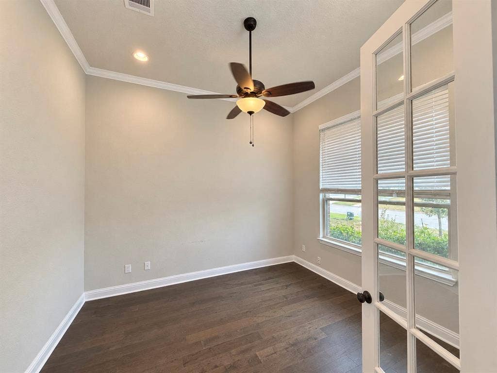 6414 Waggoner Court, Temple, TX 76502 Room featuring wood-finish flooring, crown molding, recessed lighting, a ceiling fan with integrated light fixture, and French doors