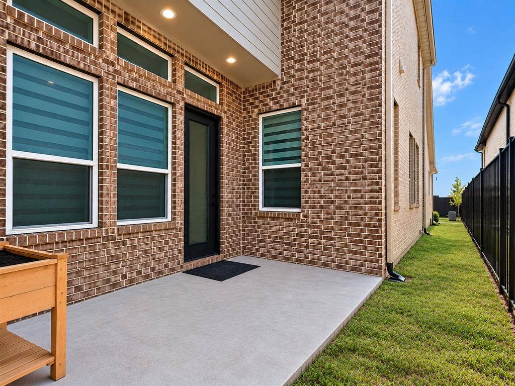 8705 Bethpage Drive, McKinney, TX 75070 Patio Area, Grassy Sideyard, and Wrought Iron FencPatio Area, Private Space to relax and unwind Grassy Sideyard, and Wrought Iron Fencing