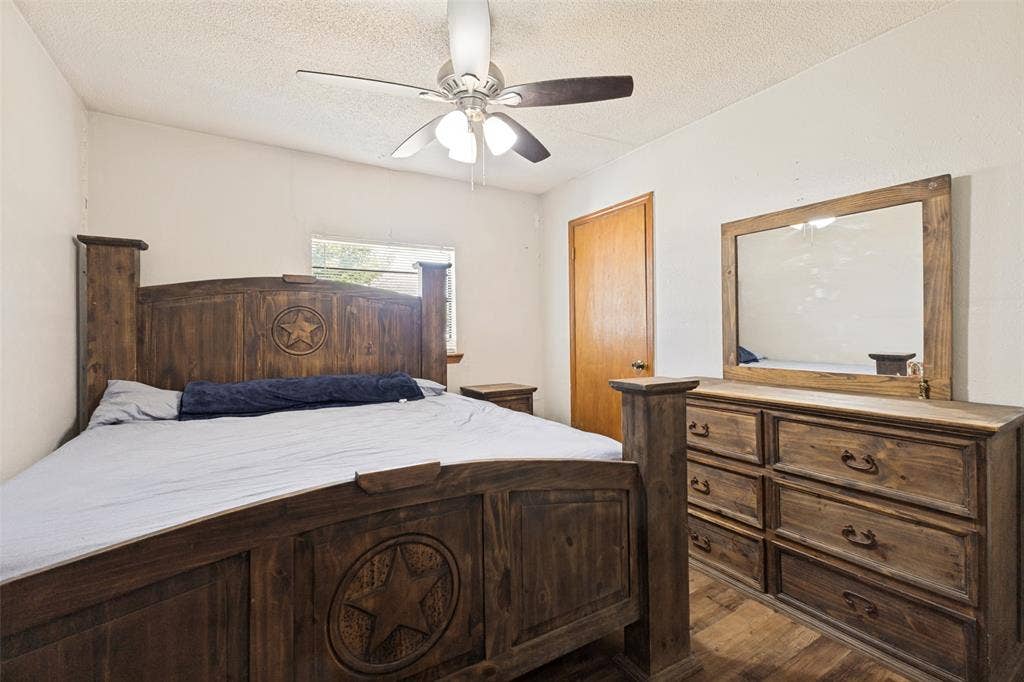 7400 County Road 131A, Terrell, TX 75161 Wood-finish flooring, ceiling fan with integrated lighting, and solid core wood door