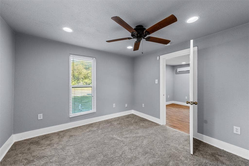 2222 Speight Avenue, Waco, TX 76706 Interior room featuring neutral wall paint, recessed lighting, a ceiling fan with dark wood-finish blades, and carpeted flooring