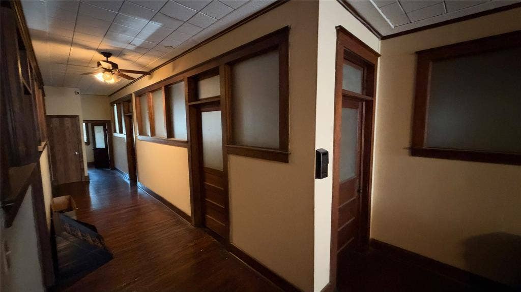 111 E Virginia Street, McKinney, TX 75069 Hallway with original frosted-glass office doors and transoms